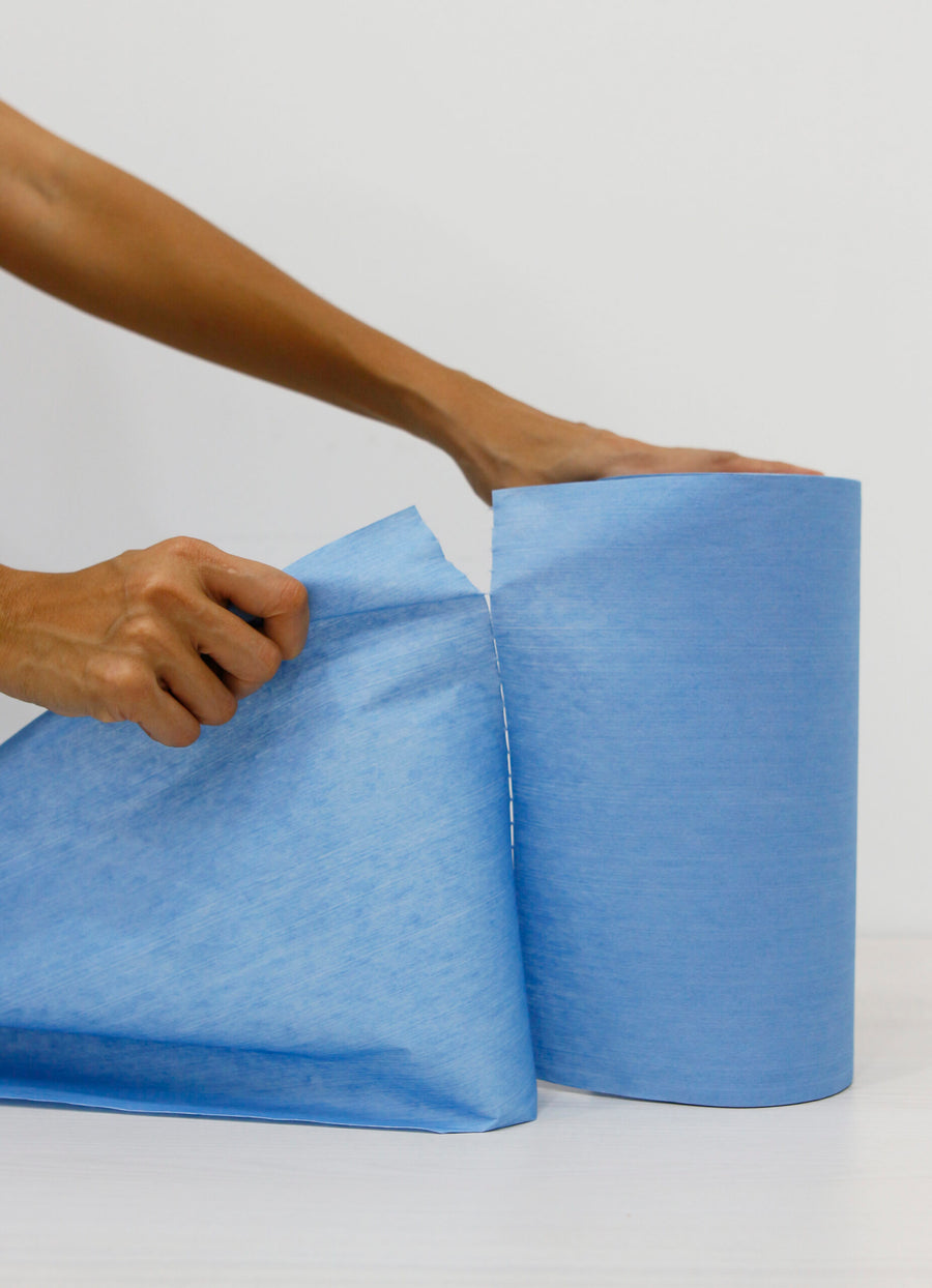 Tearing off a sheet of multi purpose non woven wipes